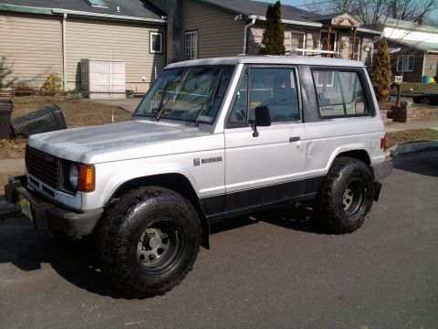 1987 Mazda RX-7 - This two-door SUV, identified by its "Raider" badge, is seen from a three-quarter front angle.