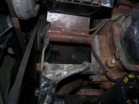 1989 Ford Bronco - Close-up view of engine components, including belts and pulleys, in a vehicle's engine bay.