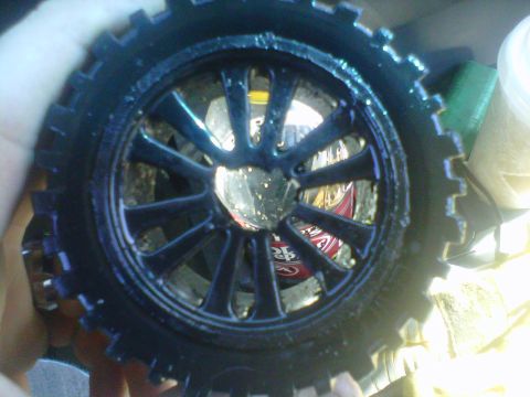 2011 Ford 427 - A close-up of a toy car wheel, showing its detailed rim and tire. The registry claim is incorrect.