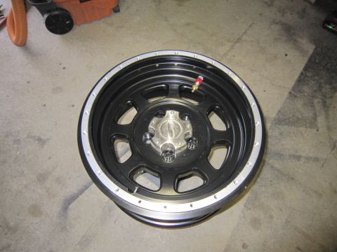 2008 Jeep Wrangler - A single aftermarket wheel is shown, likely for a truck or SUV, with a silver lip and black spokes.