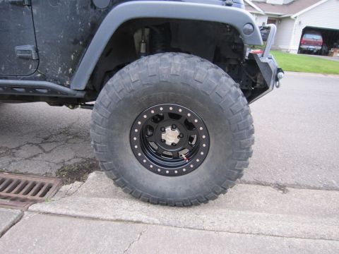 2008 Jeep Wrangler - Modified Jeep Wrangler wheel and tire, showing off its off-road capabilities.