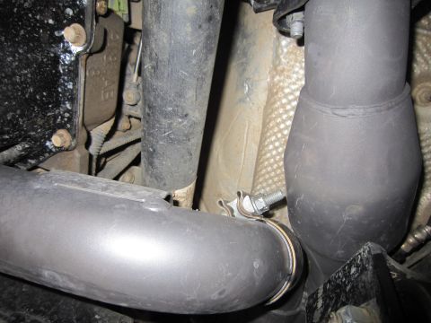 2008 Jeep Wrangler - Engine bay detail showing exhaust system components and part markings.
