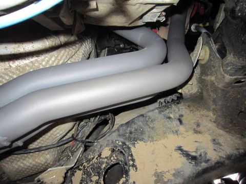 2008 Jeep Wrangler - The image shows a close-up view of exhaust headers and associated wiring, likely from the underside of a vehicle.