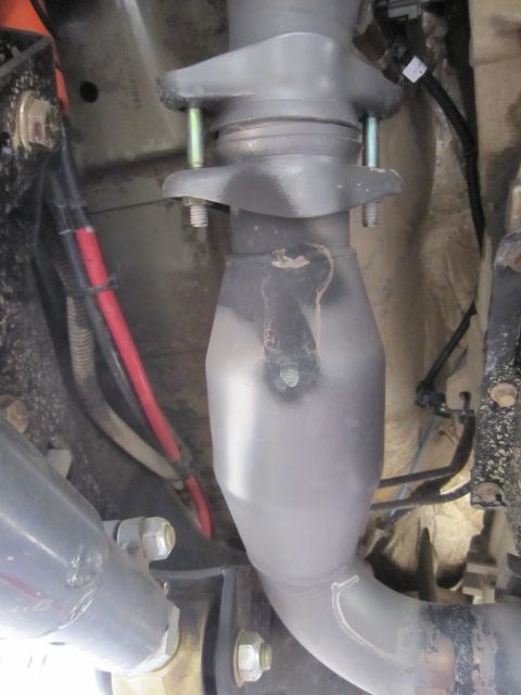 2008 Jeep Wrangler - Close-up view of a vehicle's exhaust system components.