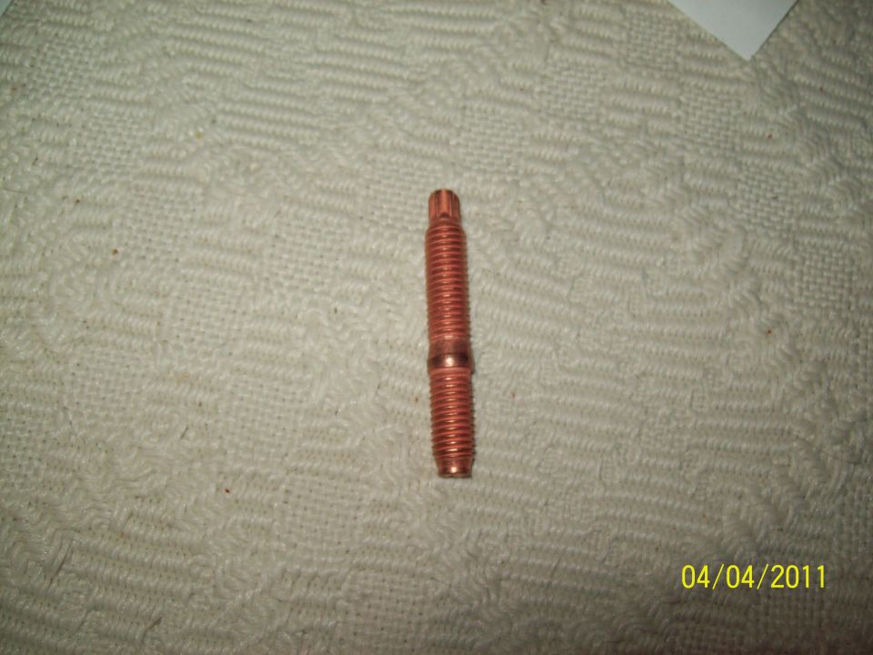 Copper-plated double-ended threaded stud on a paper towel, dated 04/04/2011