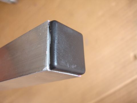 1993 Ford Taurus - A metal tube with a black plastic cap is shown in a close-up view.