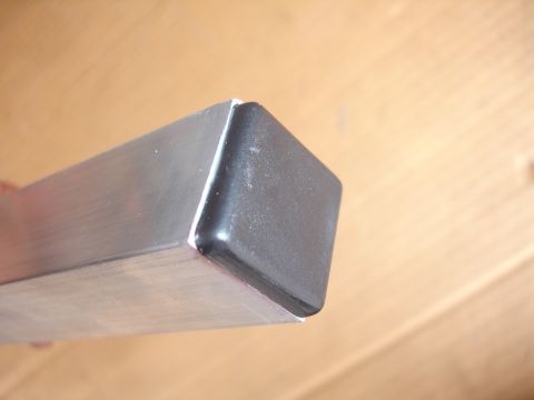1993 Ford Taurus - A metal bar with a protective rubber cap is shown from a close-up perspective.