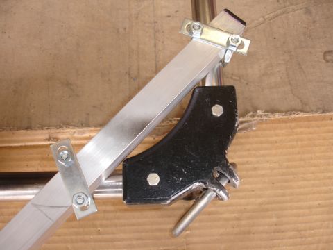1993 Ford Taurus - Close-up of an aluminum camera mount bracket with a black plastic component.
