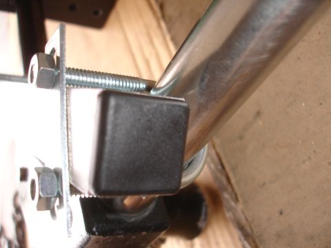 1993 Ford Taurus - Close-up of hardware for a camera mount, showing a bolt, nut, and rubber foot.