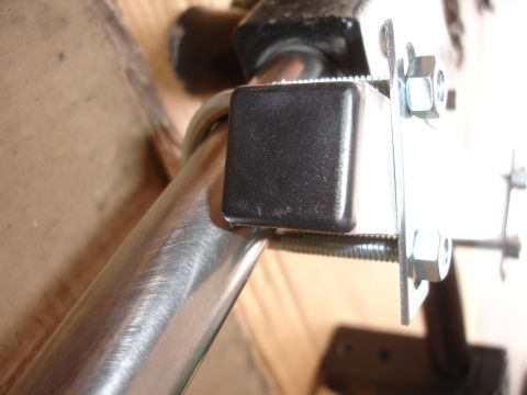 1993 Ford Taurus - Hardware for a camera mount, showing bolts and a protective cap on a metal tube.