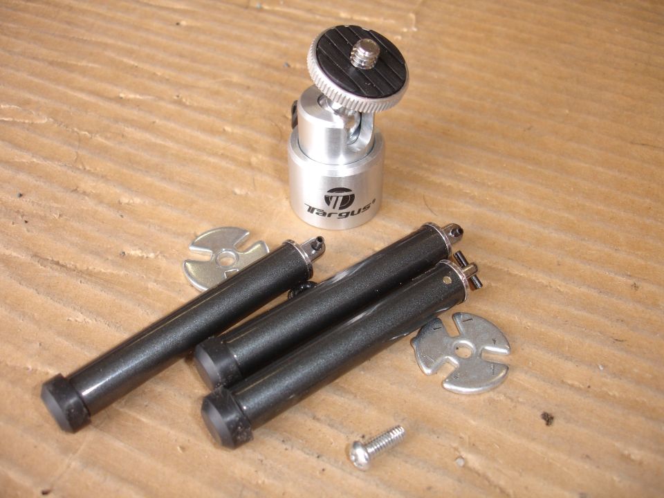 Camera mount with three black legs and two metal washers