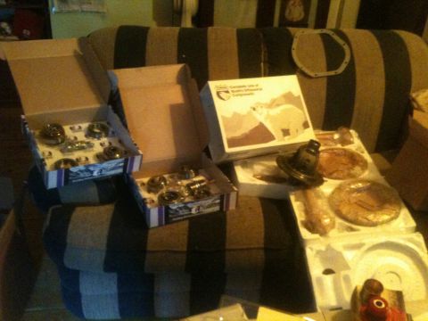 1993 Ford Bronco - Several boxes containing differential parts are laid out on a couch.