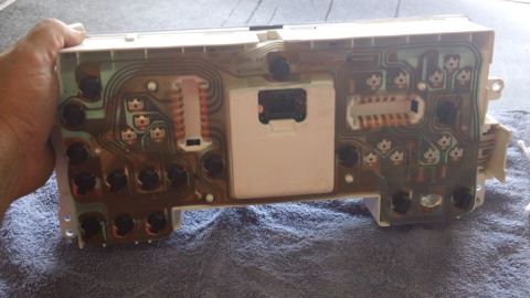 1994 Ford Bronco - Back of an instrument cluster circuit board, showing the intricate wiring and components.