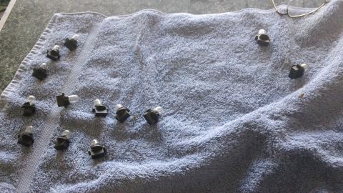 1994 Ford Bronco - A collection of small light bulbs are spread out on a towel, likely for replacement or repair.