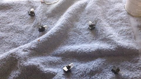 1994 Ford Bronco - Small automotive light bulbs are laid out on a blue towel, possibly for replacement or repair.