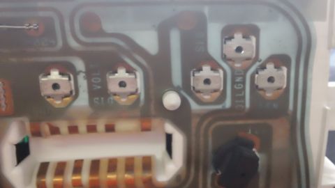 1994 Ford Bronco - Circuit board from an automotive instrument cluster shows electrical connectors and printed text.