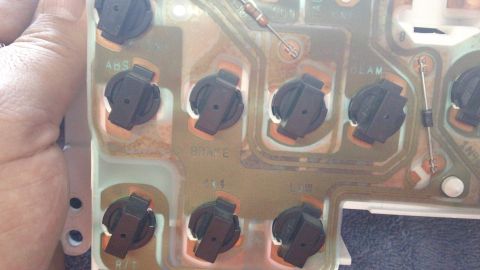 1994 Ford Bronco - Close-up of an automotive instrument cluster's circuit board, showing various electrical components and labels.