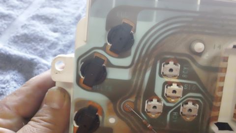 1994 Ford Bronco - Close-up of an instrument cluster's circuit board, showing electrical components and connectors.