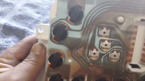 1994 Ford Bronco - Circuit board from an automotive instrument cluster, showing electronic components and wiring traces.