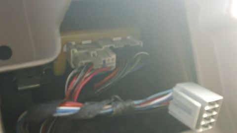 1994 Ford Bronco - Close-up view of electrical connectors and wiring within a vehicle's interior.