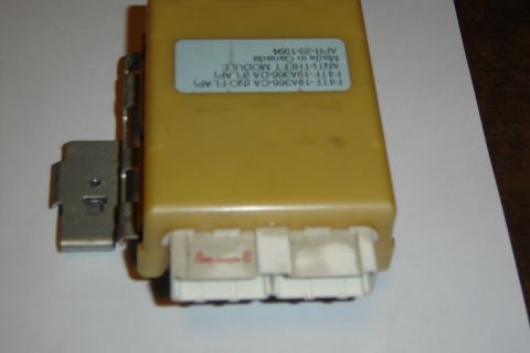 1996 Ford Bronco - Anti-theft module part with visible part number and manufacturing date.