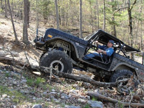 1967 Ford Mustang - This heavily modified Ford Bronco tackles a challenging off-road trail, its capabilities.