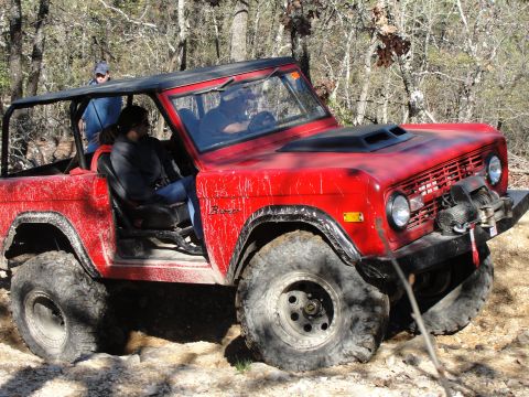 1967 Ford Mustang - This red SUV is equipped for off-road adventures, with large tires and a winch mounted on the front.