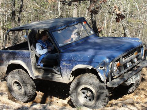 1967 Ford Mustang - This blue Ford Bronco navigates a rocky trail, demonstrating its off-road capabilities.