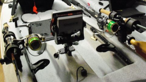 1953 Ford Mainline - Kayak setup with fishing rods, reels, and fish finder.