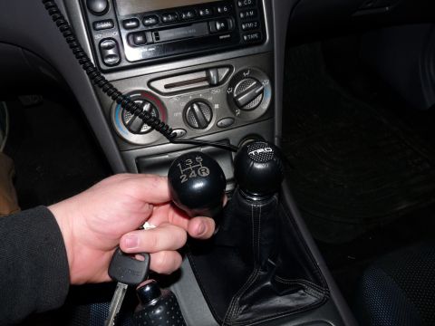 2006 Ford E350 - Interior shot of a manual transmission car, showing gear shift knobs and car keys.