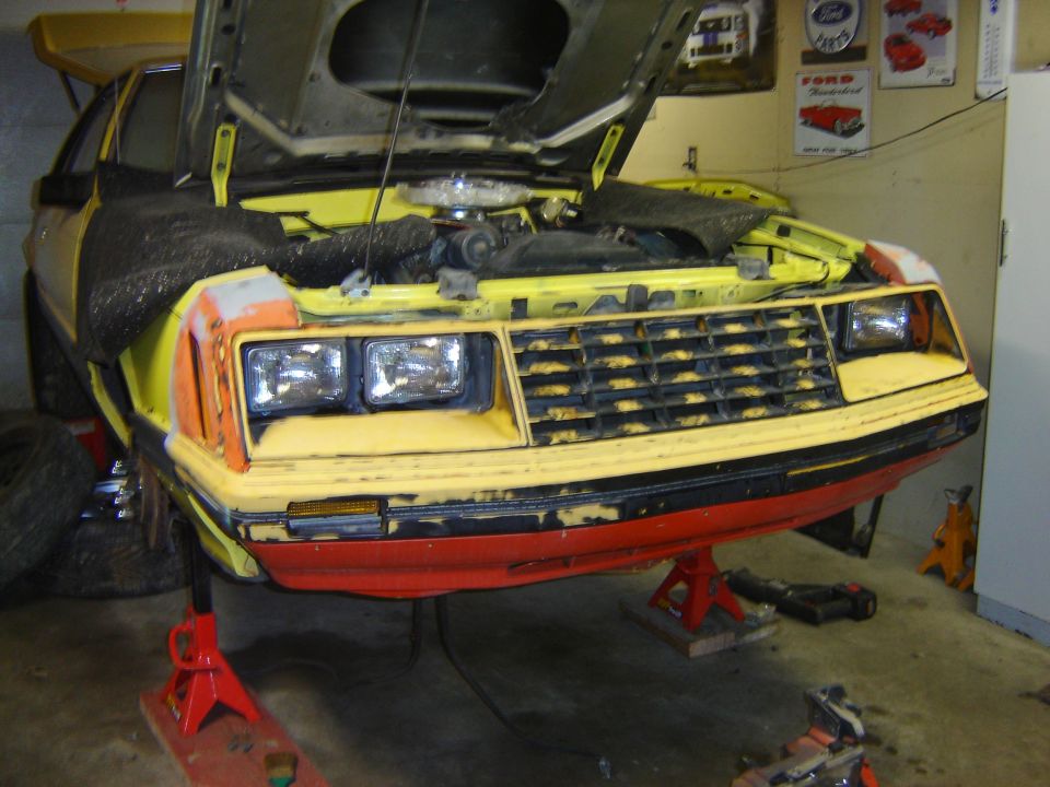 1979 Ford Mustang front end with hood open, on jack stands