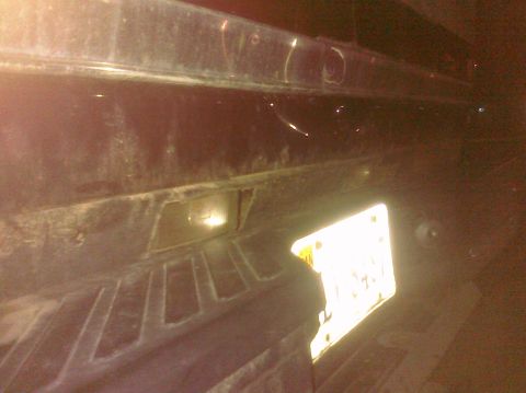 1995 Ford Bronco - Close-up view of the rear bumper and license plate area of a vehicle.