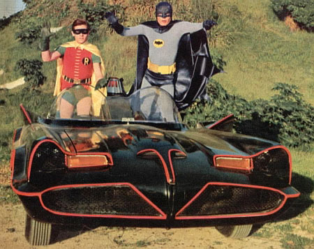 2006 Ford E350 - Batman and Robin pose in the iconic Batmobile.