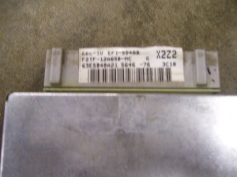 1991 Ford Bronco - Close-up of an engine control unit, identified by the part number F21F-12A650-MC and code X222.