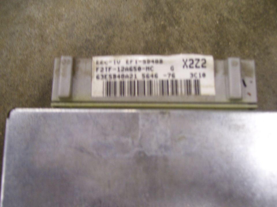 Engine control unit with label F21F-12A650-MC and X222