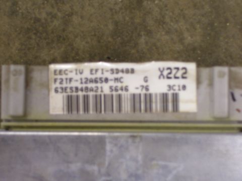 1991 Ford Bronco - Close-up of a Ford EEC-IV EFI-SD48B engine control unit part.