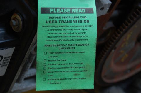 1985 Mercury Grand Marquis - A green tag provides a preventative maintenance checklist for a used transmission before installation.
