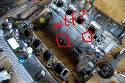1985 Mercury Grand Marquis - Close-up of an engine's intake manifold, with handwritten annotations indicating confusion or a problem.