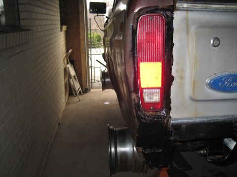 1979 Ford Bronco - Rear view of a 1979 Ford Bronco showing the taillight area and bodywork.