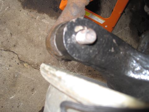1979 Ford Bronco - A close-up view of a vehicle's suspension part, possibly a ball joint, with a bolt visible.