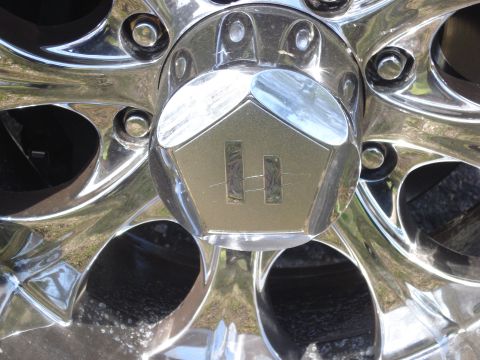 2005 Dodge 2500 - Close-up of a chrome wheel center cap a distinctive 'H' logo.