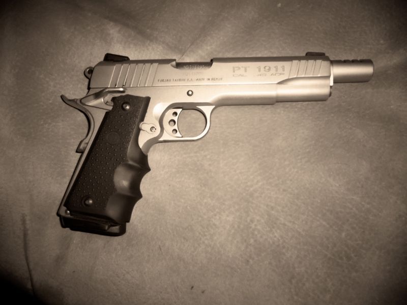 Taurus PT 1911 pistol with textured grips and extended barrel