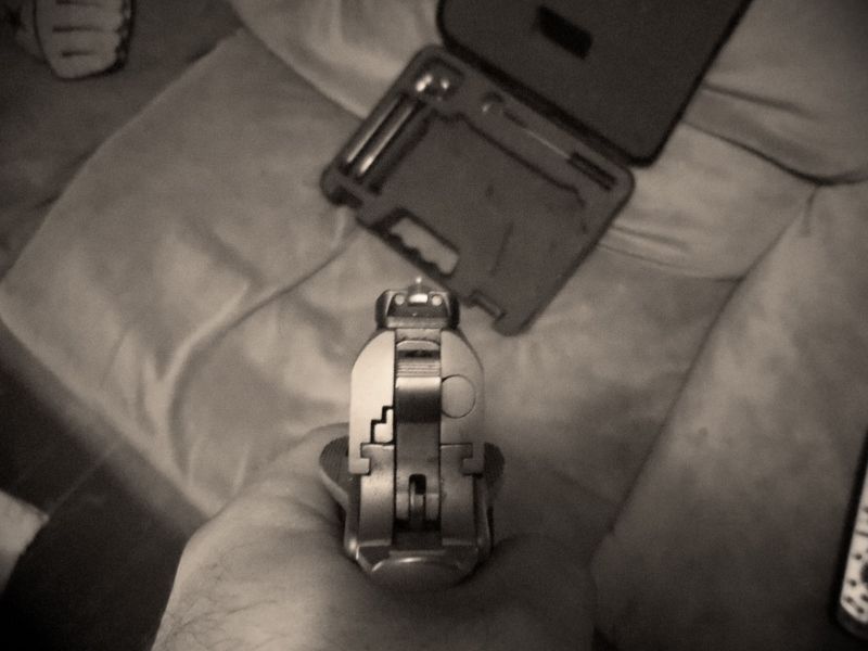 Pistol held in hand, viewed from the front