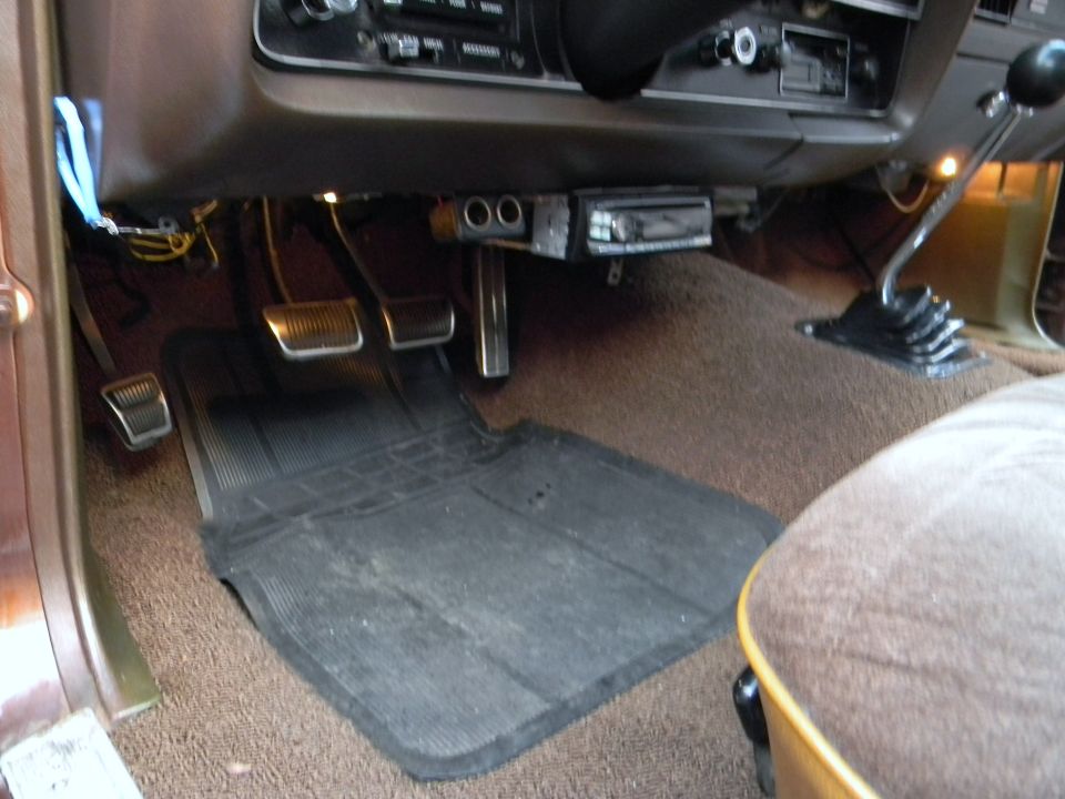1972 Ford Ranchero interior showing pedals, floor mat, and shifter