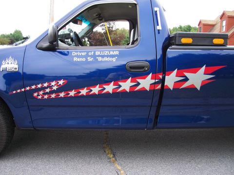 1998 Ford F-150 - This 1998 Ford F-150 features patriotic star graphics along its side and a "Driver of BLUZUMR" decal.