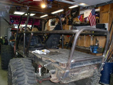 1979 Ford Bronco - This custom-built buggy is in a garage, likely undergoing modifications or repairs.