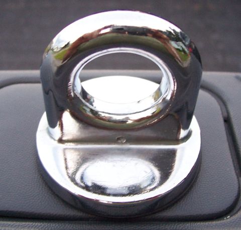 1998 Ford F-150 - Close-up of a chrome tow hook, reflecting the surroundings.