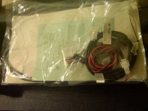 1993 Ford Bronco - Unopened package containing a wiring harness and installation instructions.