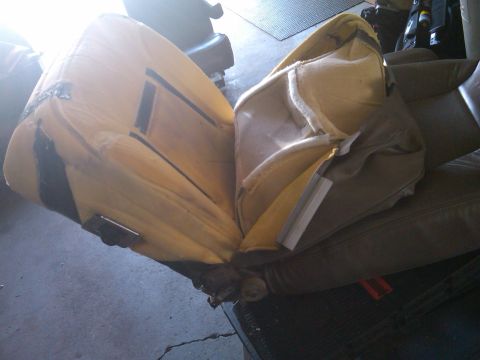 1993 Ford Bronco - The interior of a vehicle seat is exposed, revealing its foam and support structure.