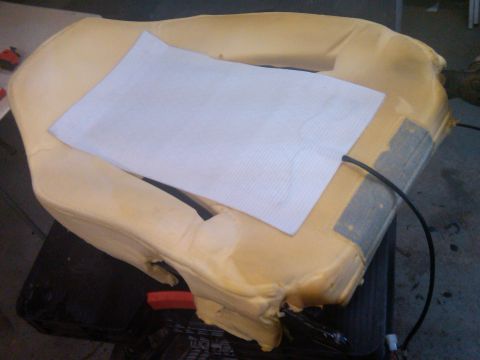 1993 Ford Bronco - A car seat cushion is shown with a heating element installed, indicating a heated seat feature.
